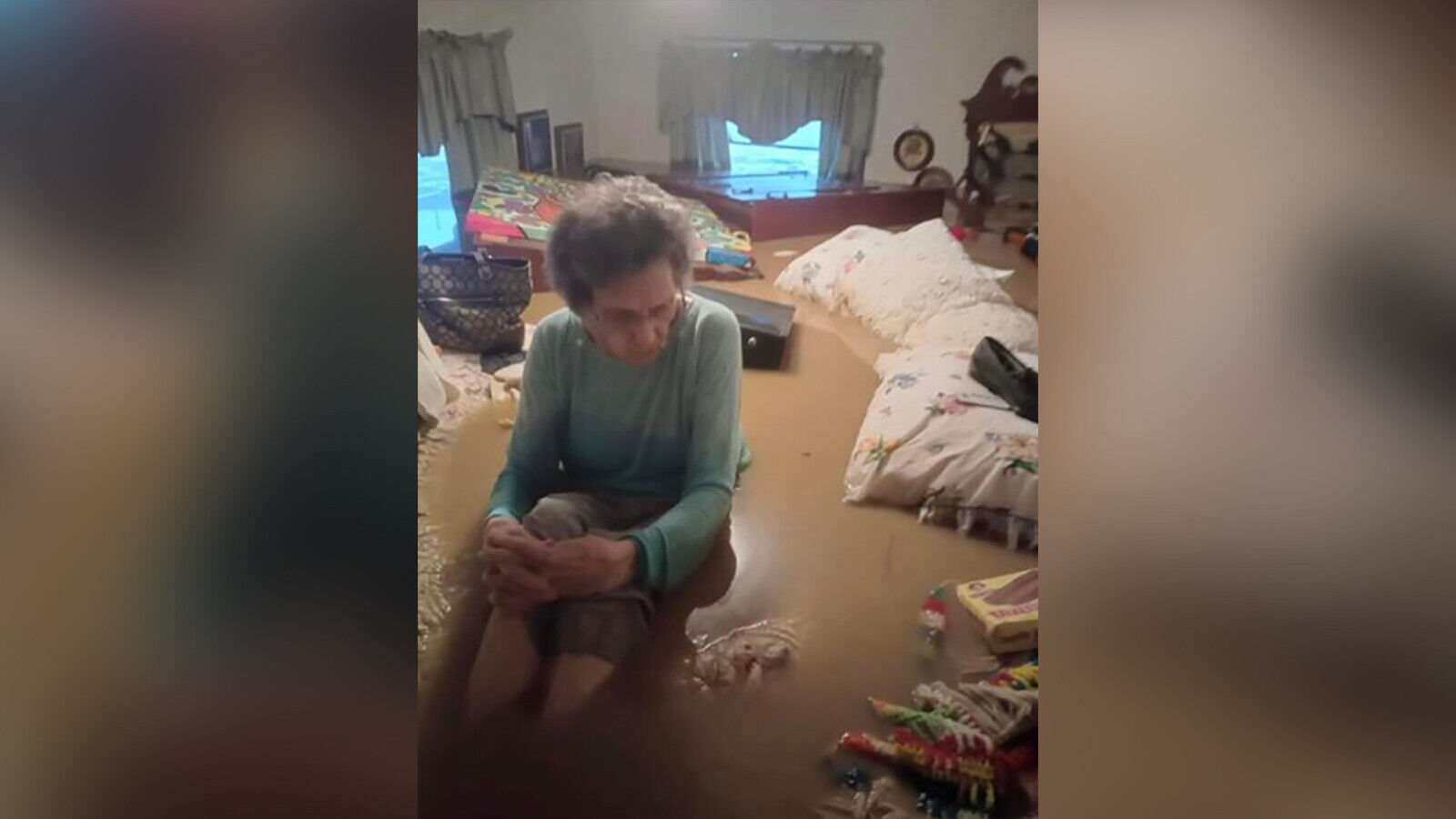 Unidentified man saves grandmother and her relatives as their home is nearly swallowed by Kentucky floodwaters